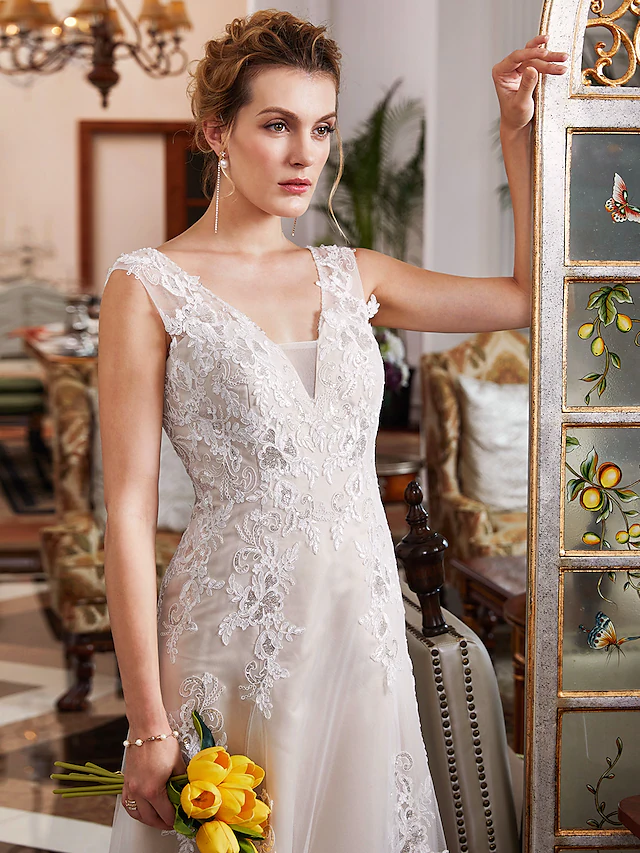 Side view of a bride wearing the A-Line V-Neck wedding dress, emphasizing its flattering silhouette.