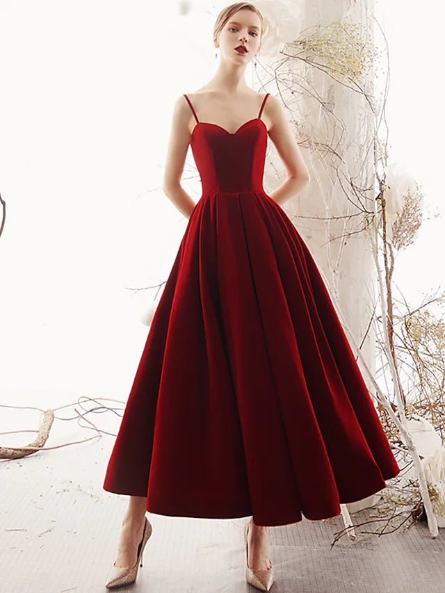 Elegant A-line velvet prom dress with spaghetti straps and a beautiful back.