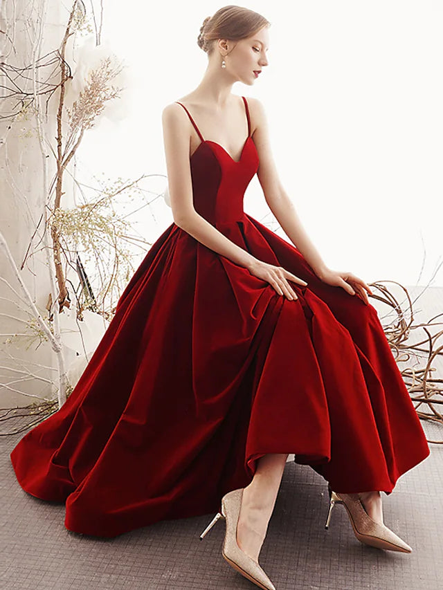 Close-up of the velvet fabric and spaghetti strap detail on the prom dress.