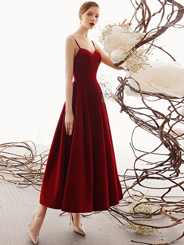 Full length view of the velvet prom dress, showcasing its elegant silhouette.