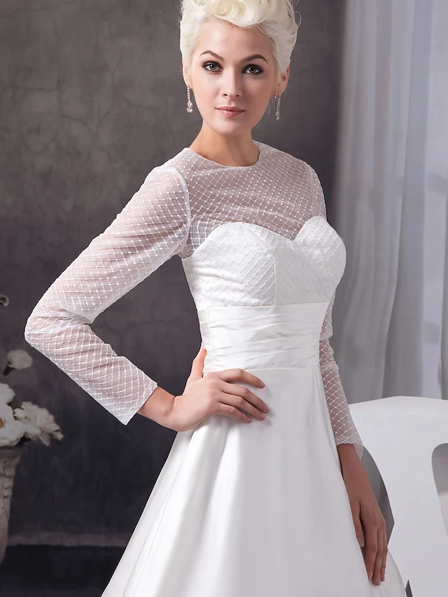 Side view of the elegant A-Line wedding gown with court train.