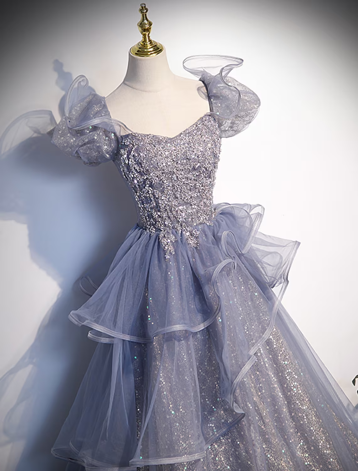 Back view of the aqua floor-length Quinceanera dress with square neckline.