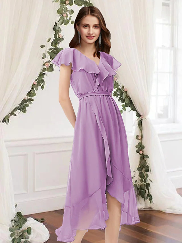 Model wearing an elegant A-Line V-neck chiffon bridesmaid dress with asymmetrical hem and pleats, front view.