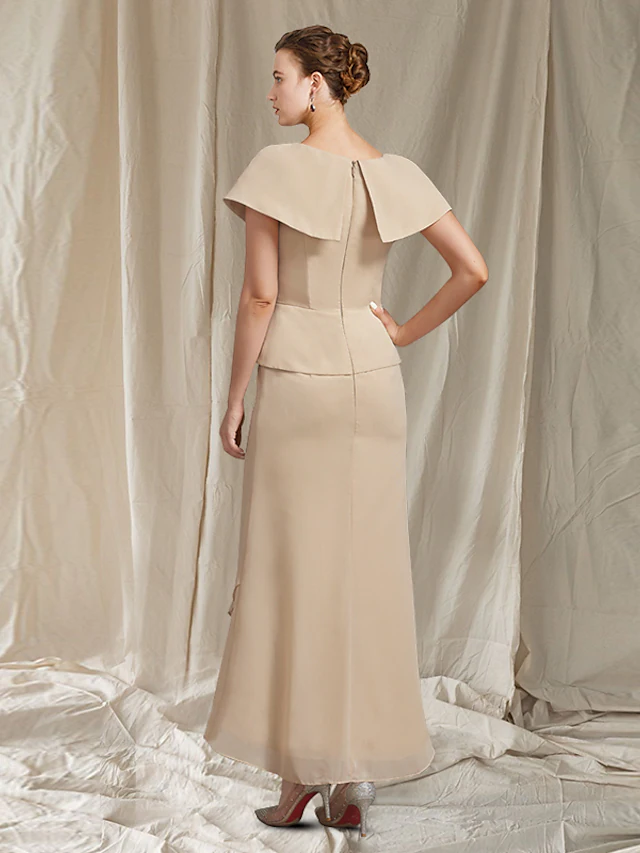 Back view of the navy chiffon Mother of the Bride dress, showcasing asymmetrical design and ankle length.