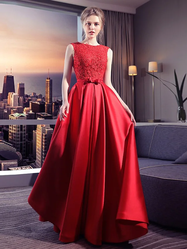 Front view of an elegant white ball gown wedding dress with a jewel neck.