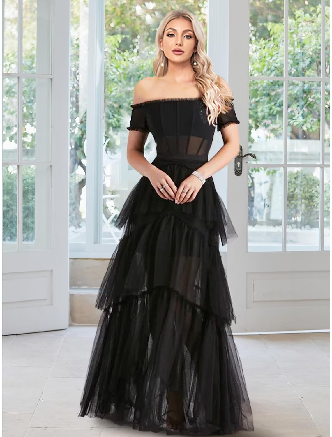 Elegant off-shoulder ball gown prom dress with ruffled tulle skirt.