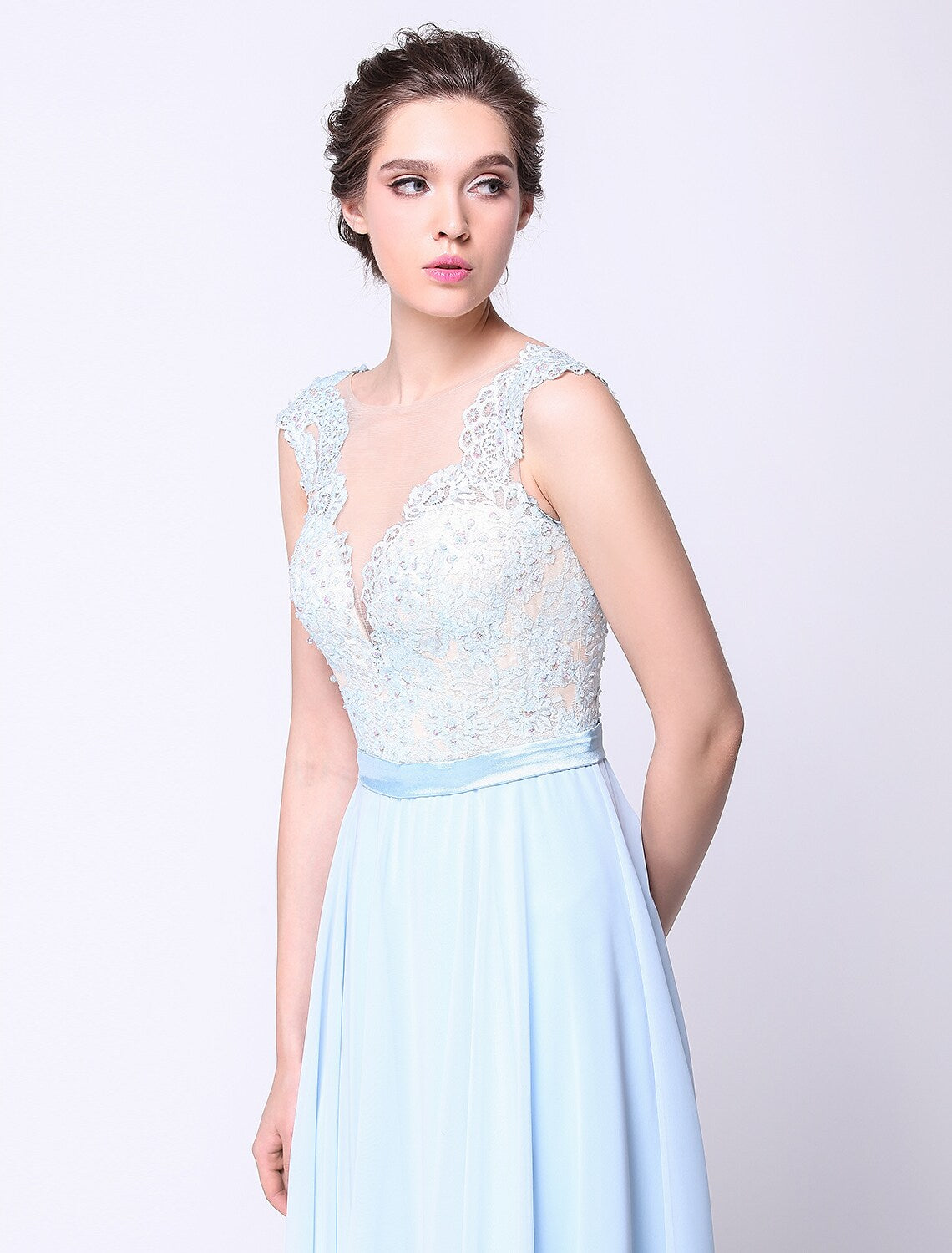 Back view of the ball gown, showcasing the open back design.
