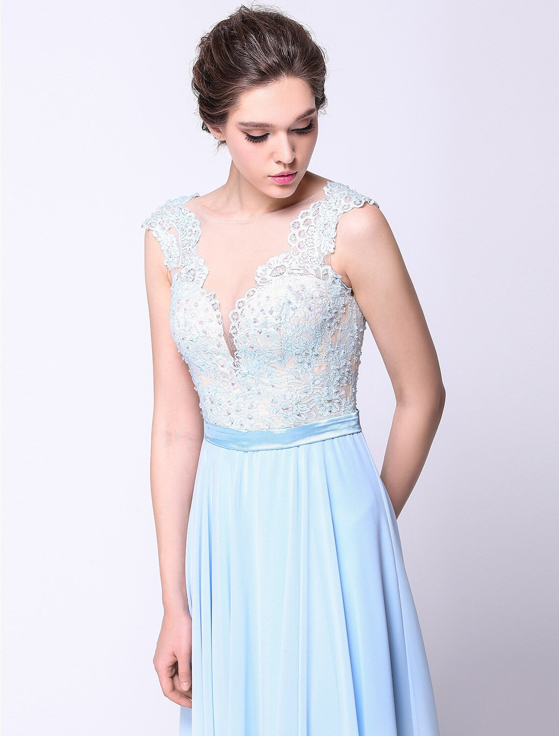 Close-up of the intricate beading appliques on the chiffon ball gown.
