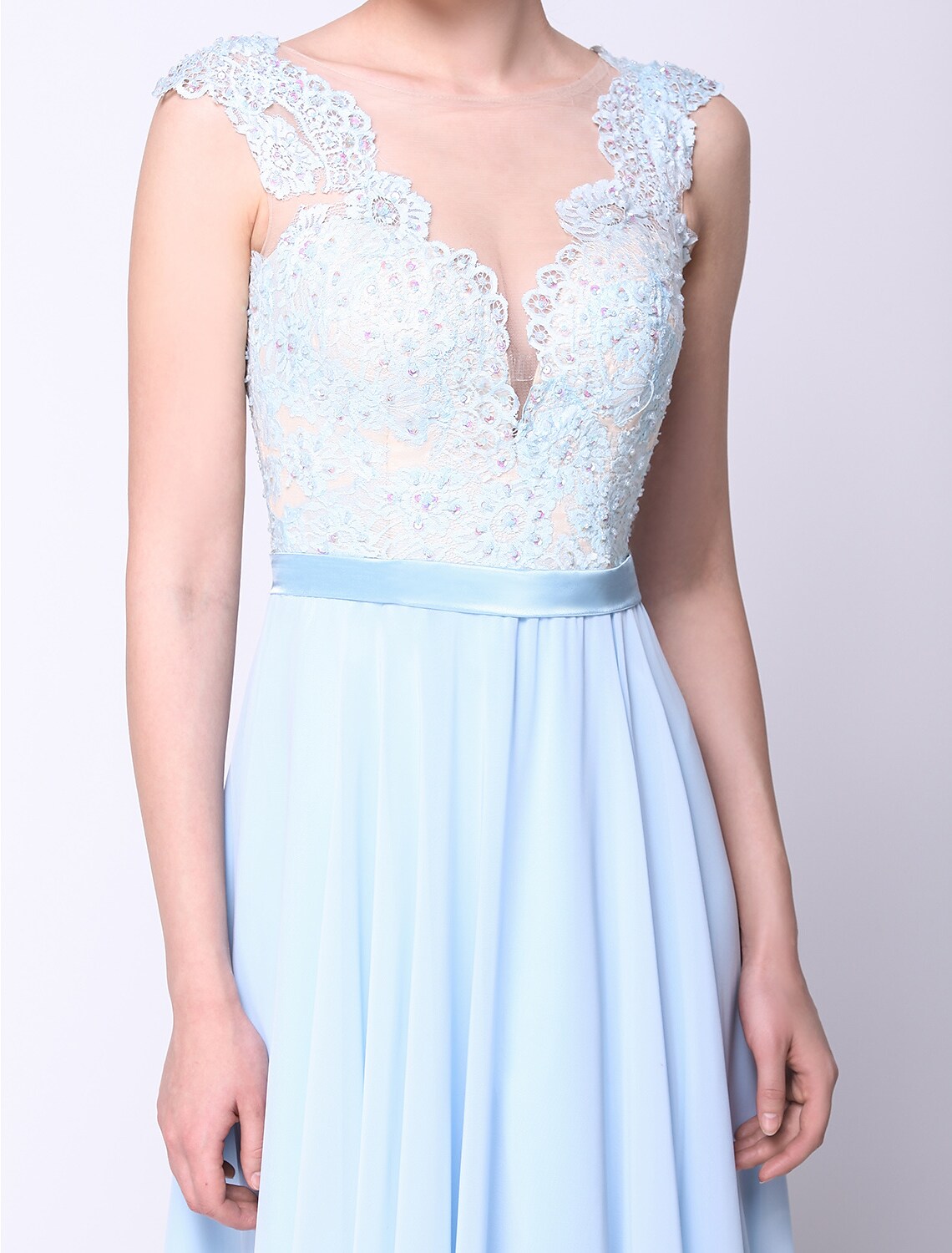 Model posing in the ball gown, highlighting the flowing chiffon fabric.