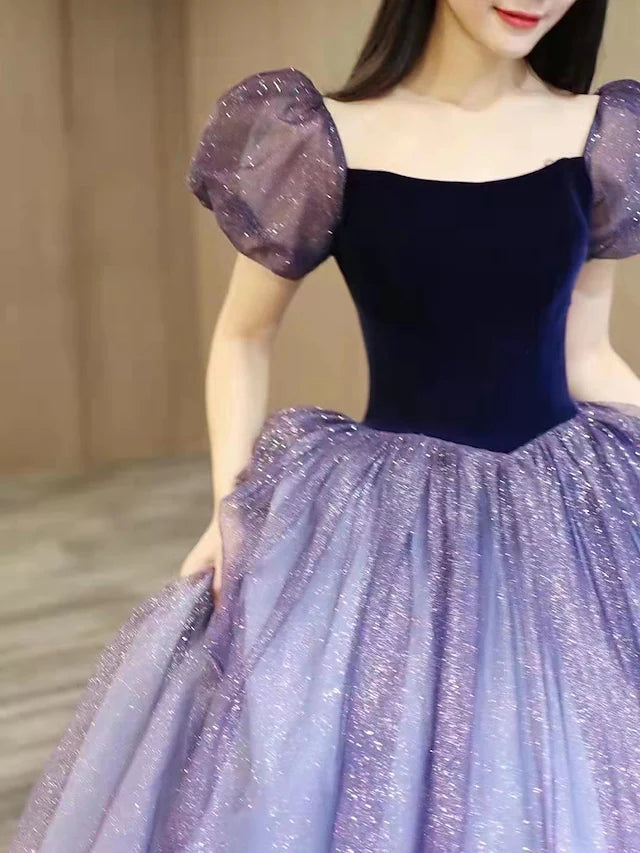 Floor-length tulle ball gown featuring sequin splicing.
