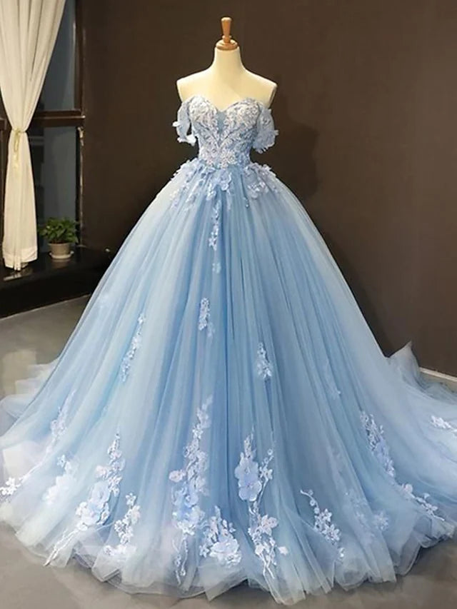 Front view of an elegant ball gown prom dress with sweetheart neckline, short sleeves, lace, and floral appliques.