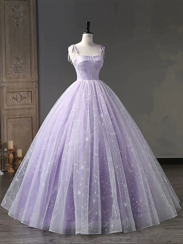 Back view of a pleated ball gown prom dress with criss-cross spaghetti straps.