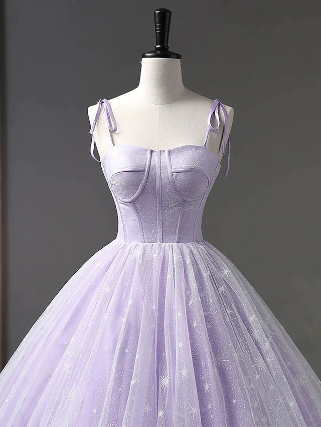 Close-up of the pleated bodice and sweetheart neckline of a tulle gown.
