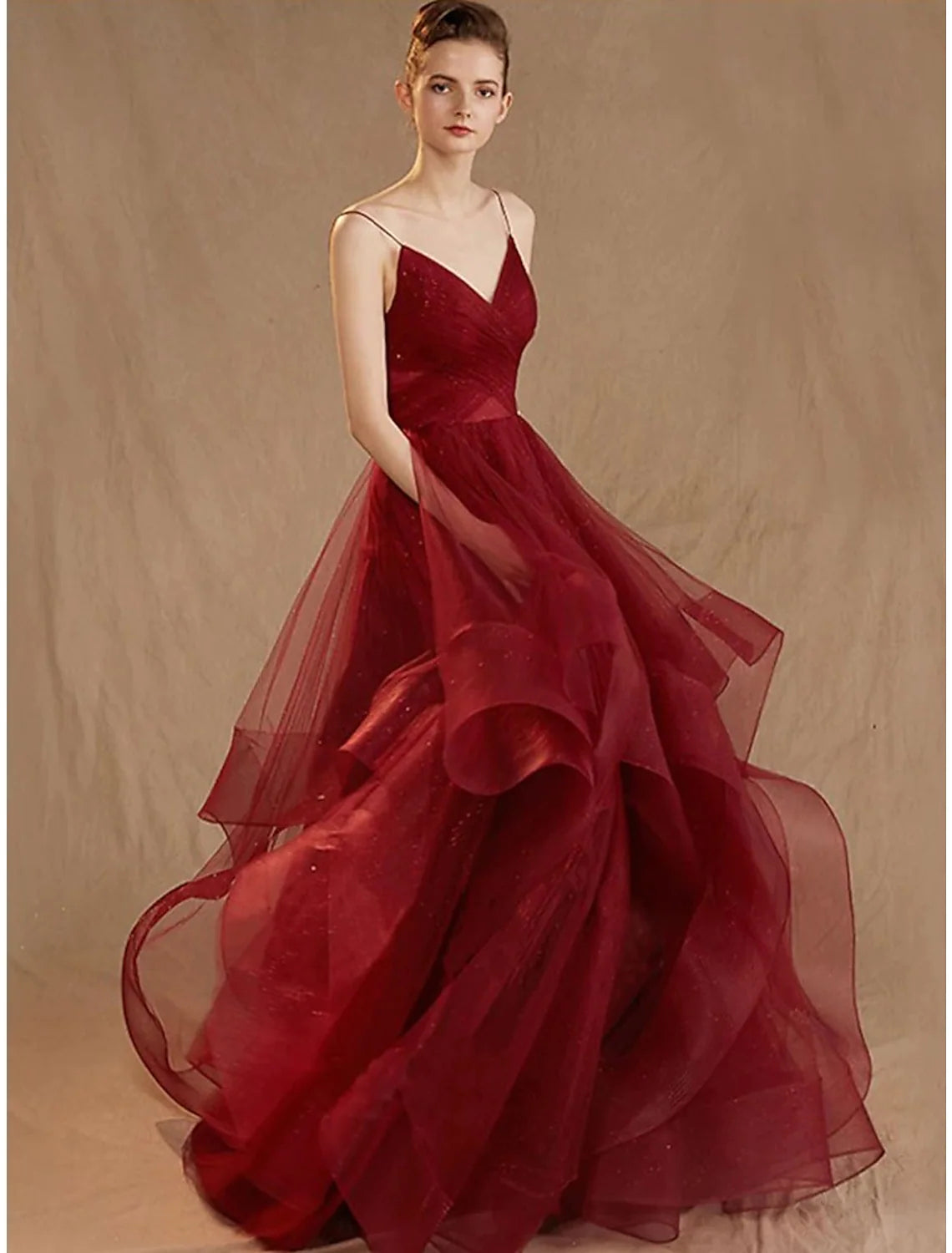 Elegant V-neck ball gown evening dress with sequin ruffles and tulle V-back.