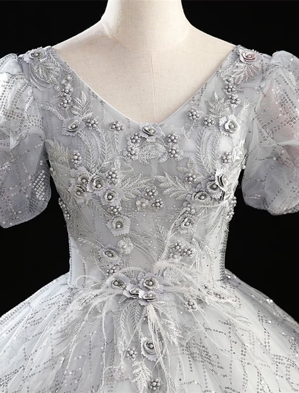 Back view of the floor-length ball gown Quinceanera dress, showcasing its full silhouette.