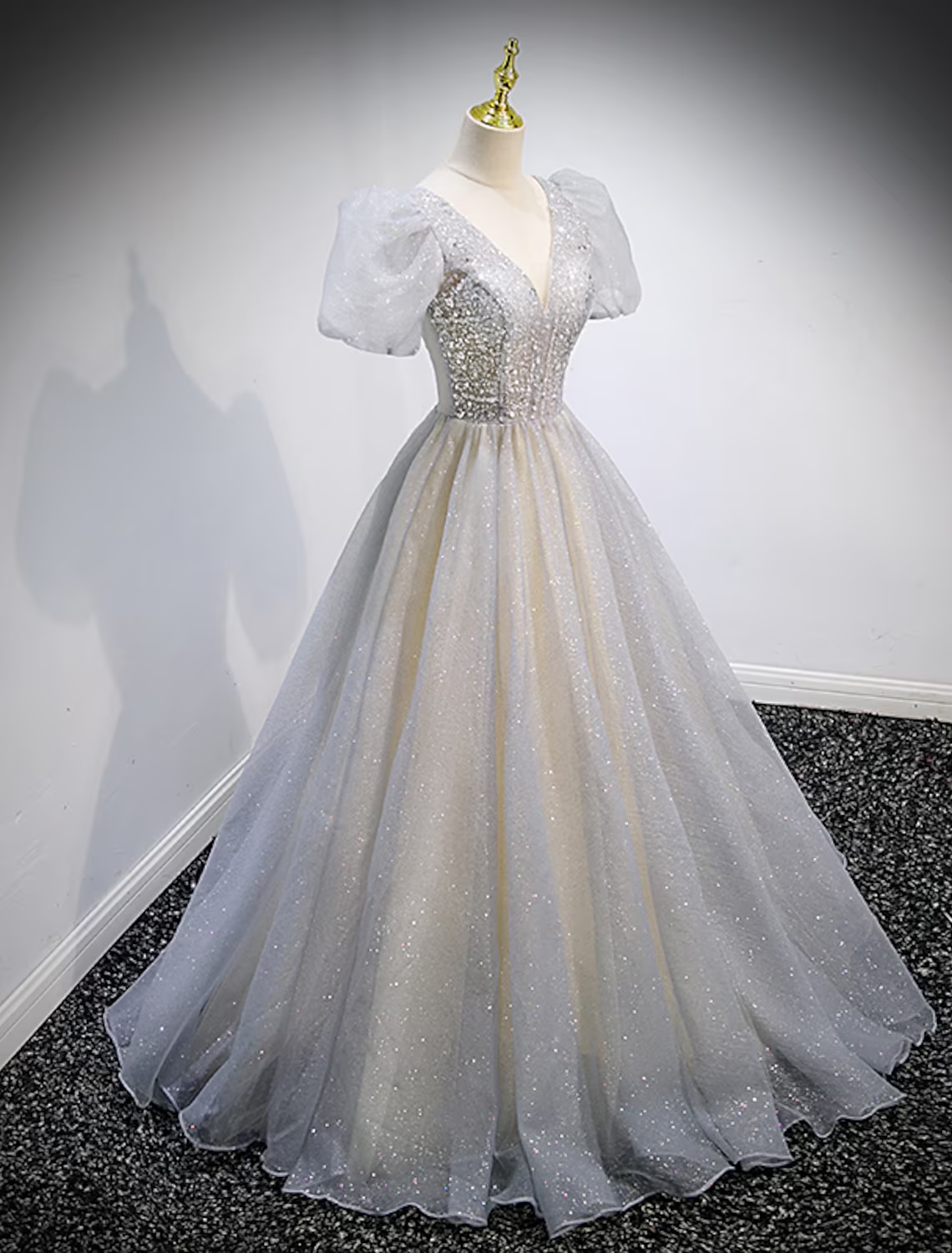 Side view of the tulle ball gown Quinceanera dress showing the sweep train.
