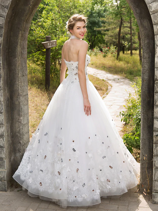 Back view of the ball gown wedding dress with lace and tulle details.