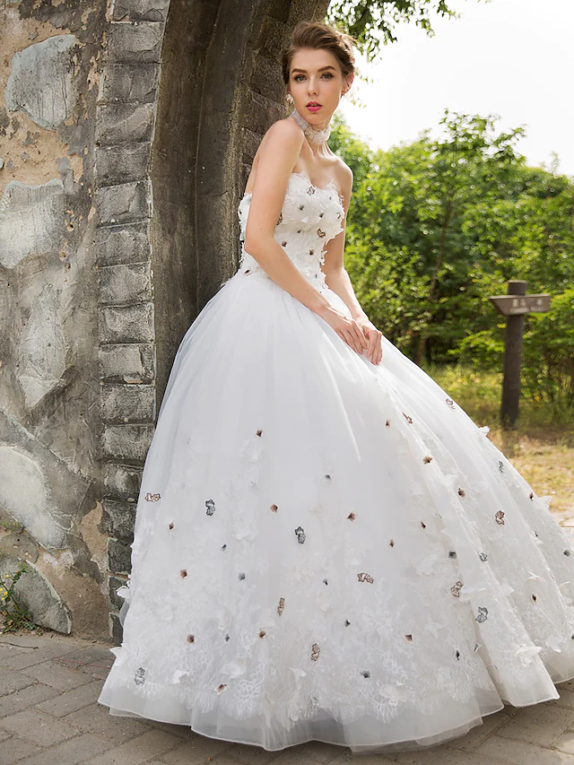 Detail of the lace appliques on the bodice of the wedding dress.