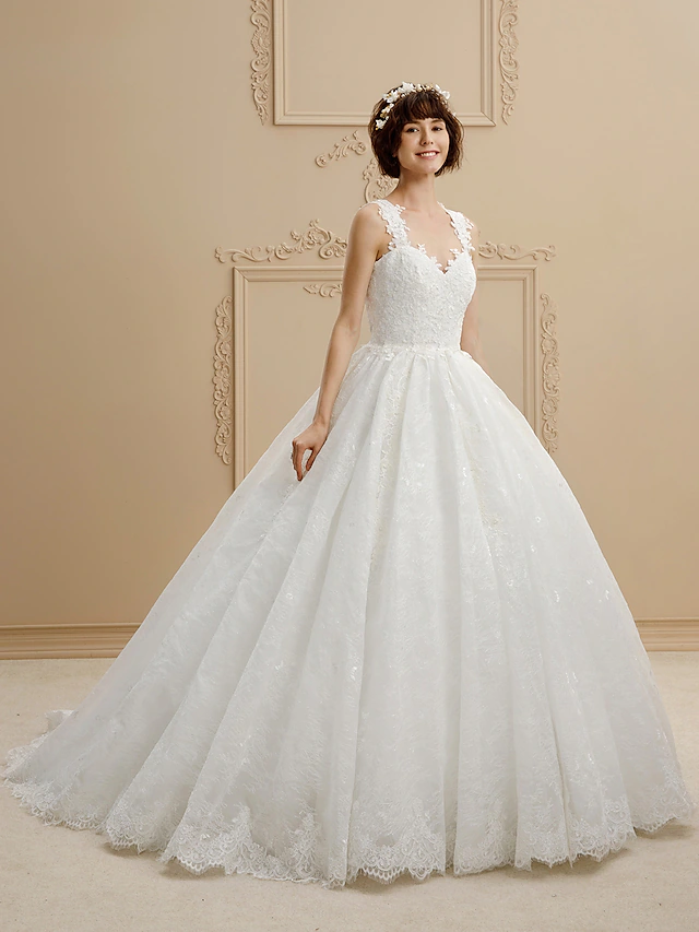 Elegant ball gown wedding dress with sweetheart neckline and lace details.