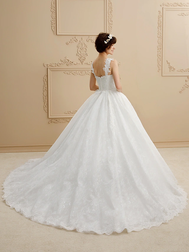 Back view of the ball gown wedding dress, showing tulle and lace.