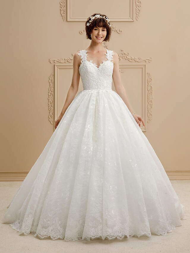 Close-up of the sweetheart neckline and lace on the wedding dress.