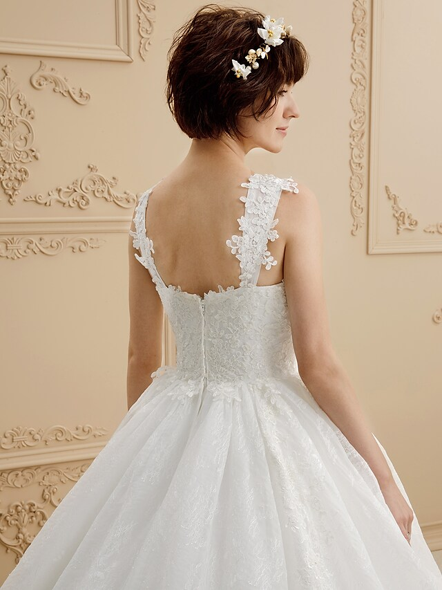 Full length view of the bridal ball gown with illusion details.