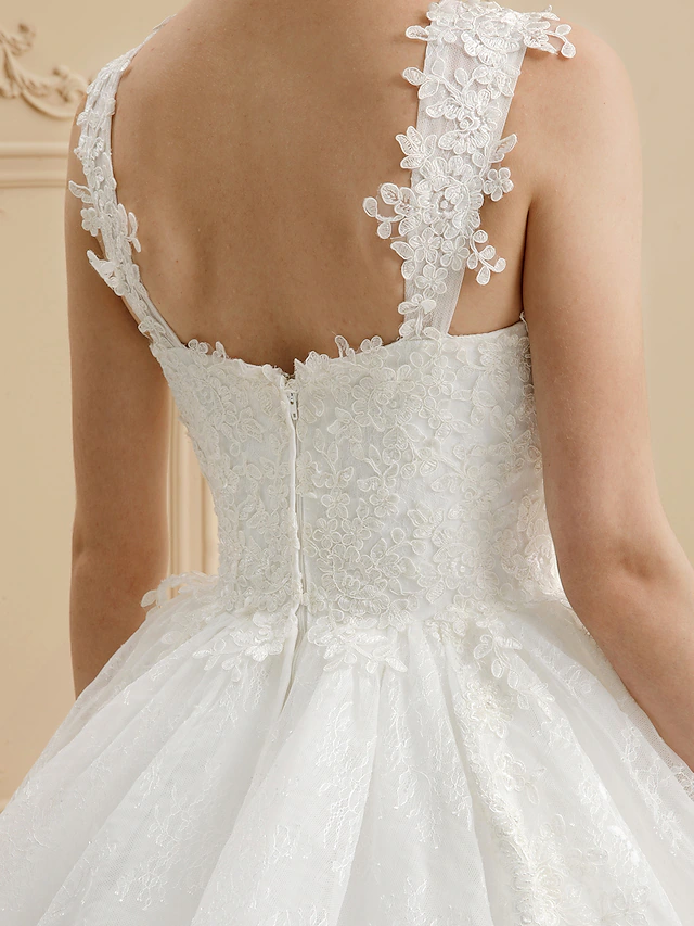 Bride wearing the tulle and lace ball gown wedding dress.