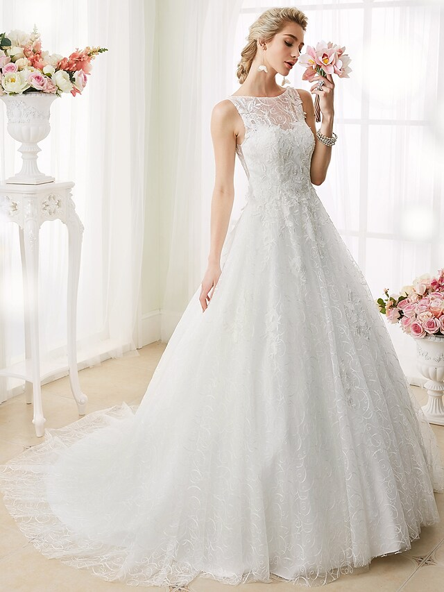 Side profile of ball gown wedding dress with court train.
