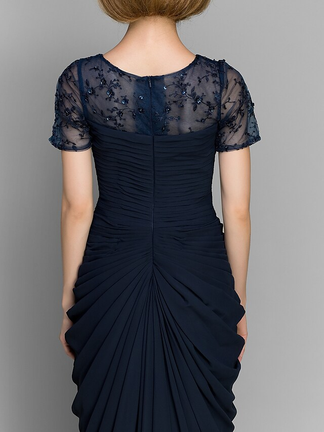 Full length view of a woman wearing the elegant Mother of the Bride dress.