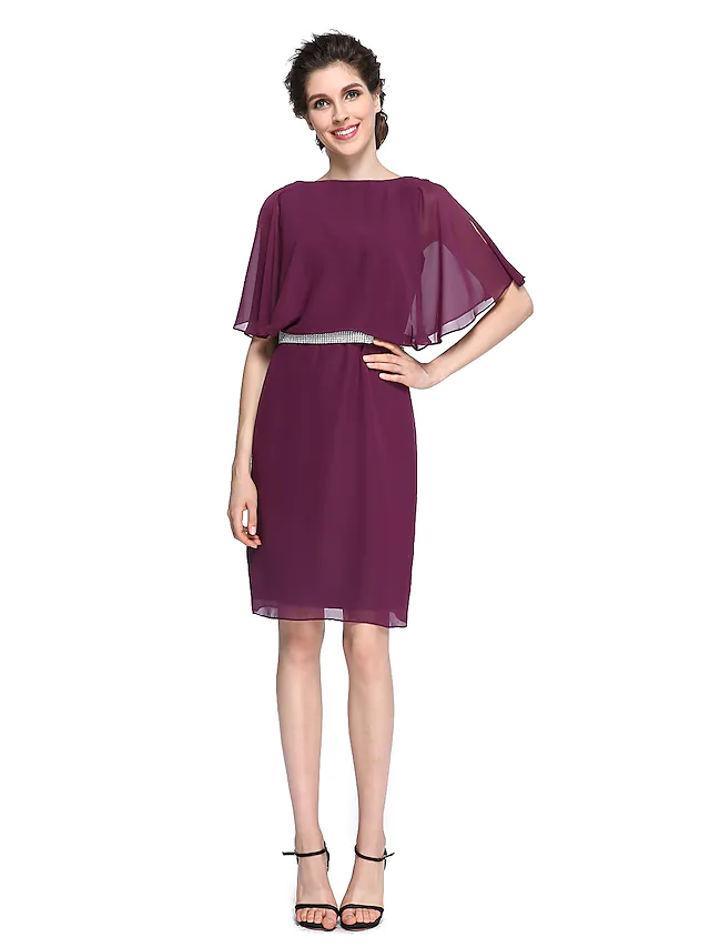 Elegant Mother of the Bride dress with bateau neck, half sleeves, and crystal details.