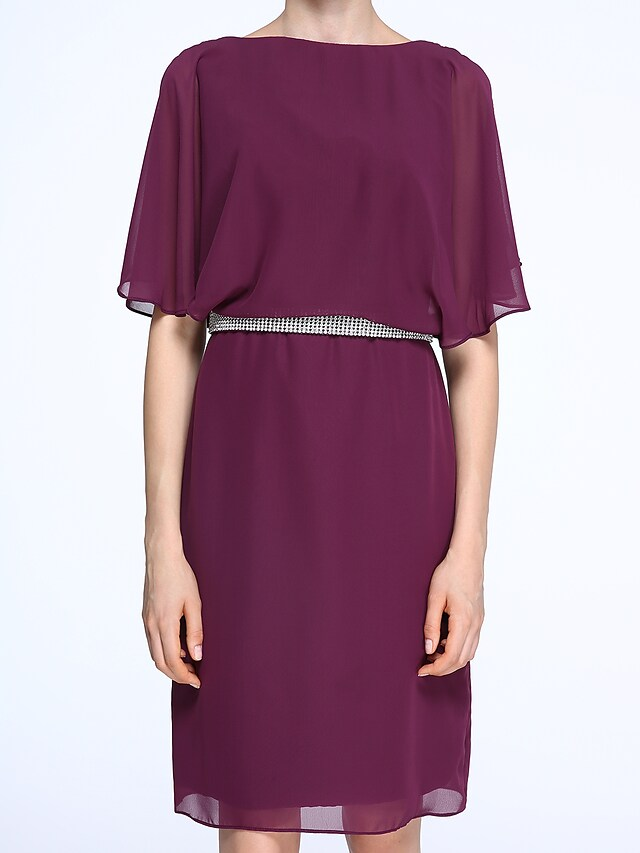 Full length view of the Mother of the Bride dress, showcasing its elegant drape.