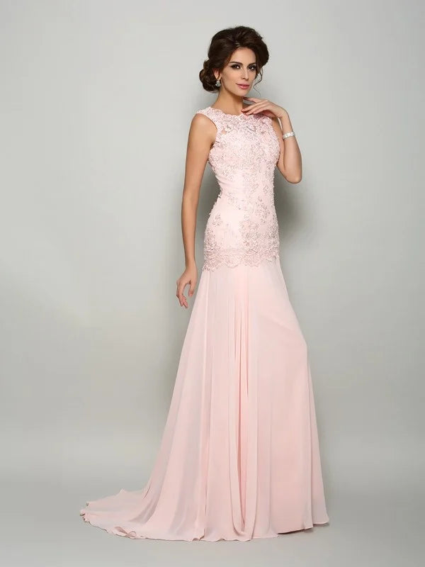 Elegant pink chiffon mother of the bride dress with scoop neckline and beading.