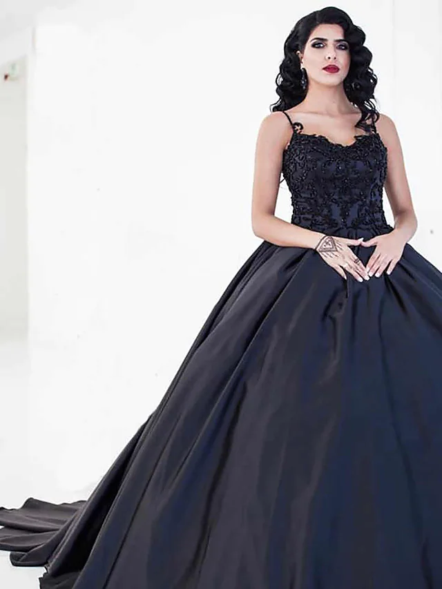 Black ball gown wedding dress with sweetheart neckline and spaghetti straps.