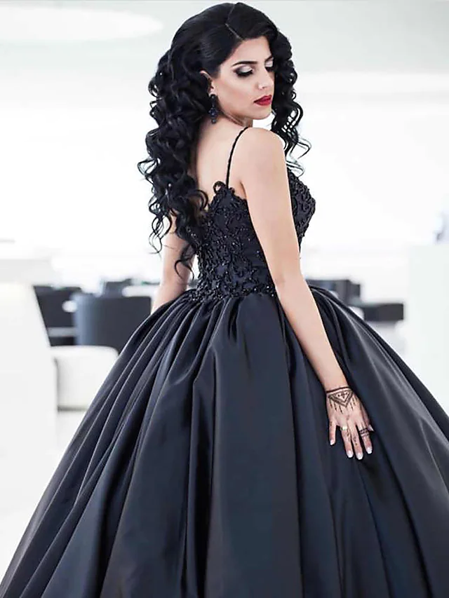 Back view of black ball gown wedding dress showing court train and lace appliques.