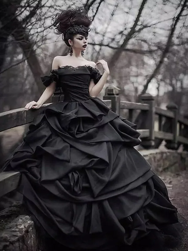 Full length view of black off-shoulder short sleeve bridal gown.