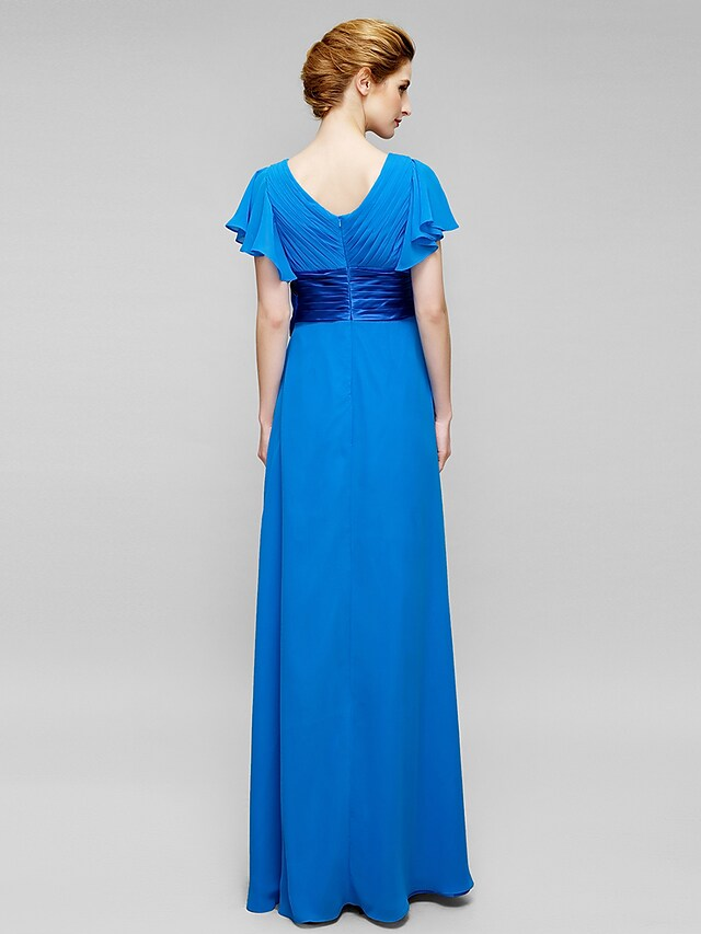 Close-up of criss-cross crystal detail on blue chiffon dress.