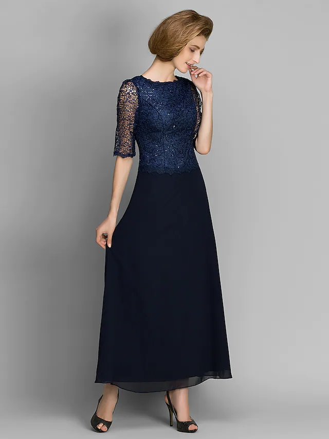 Elegant navy chiffon Mother of the Bride dress with jewel neck and half sleeves.