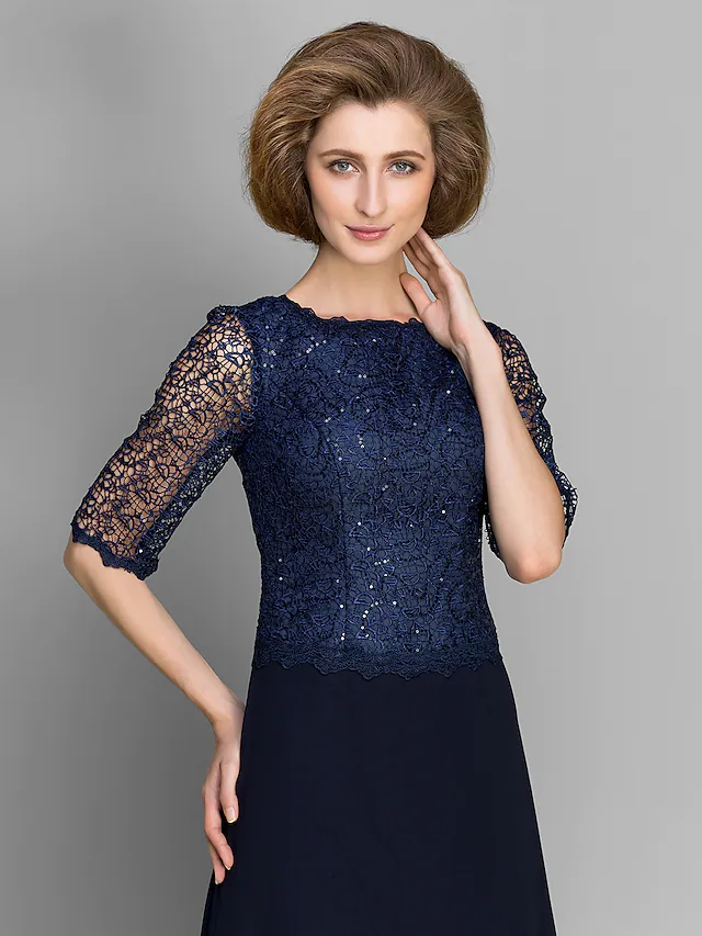 Close-up of the jewel neckline and intricate lace on the dress bodice.