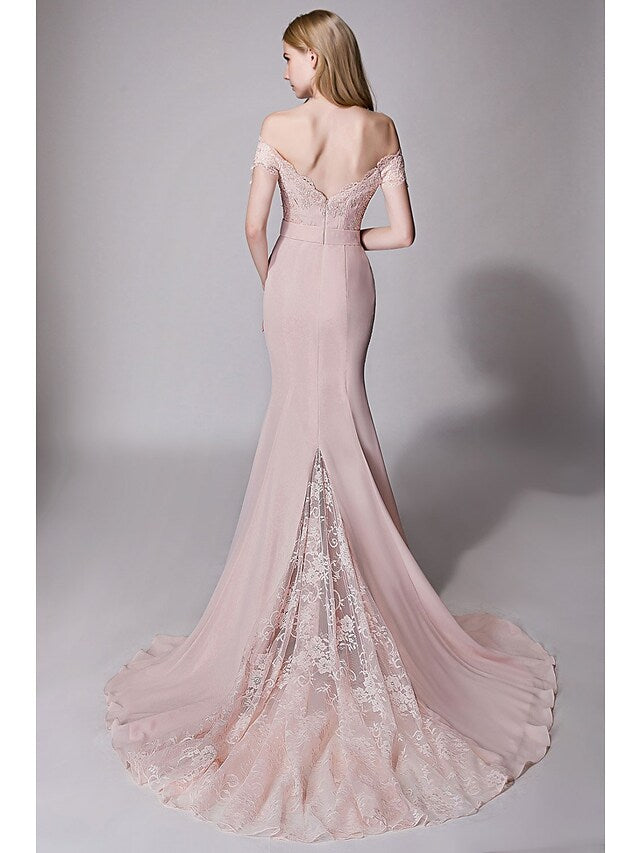 Close-up of the lace and ribbon details on a chiffon bridesmaid dress.