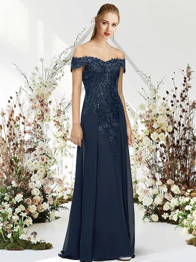 Close-up of the gown's delicate beading and applique details.