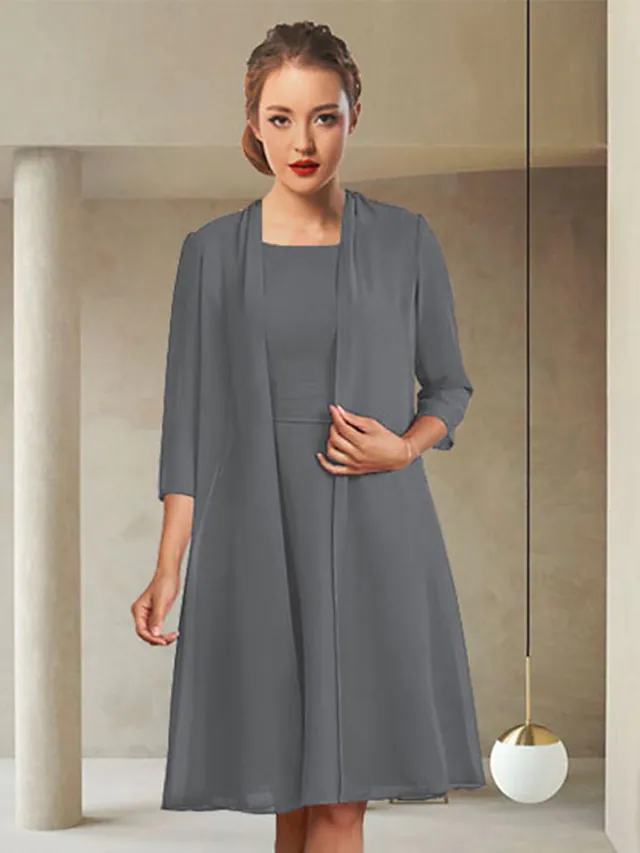 Elegant chiffon Mother of the Bride dress with jewel neck and three-quarter sleeves, featuring ruching details.