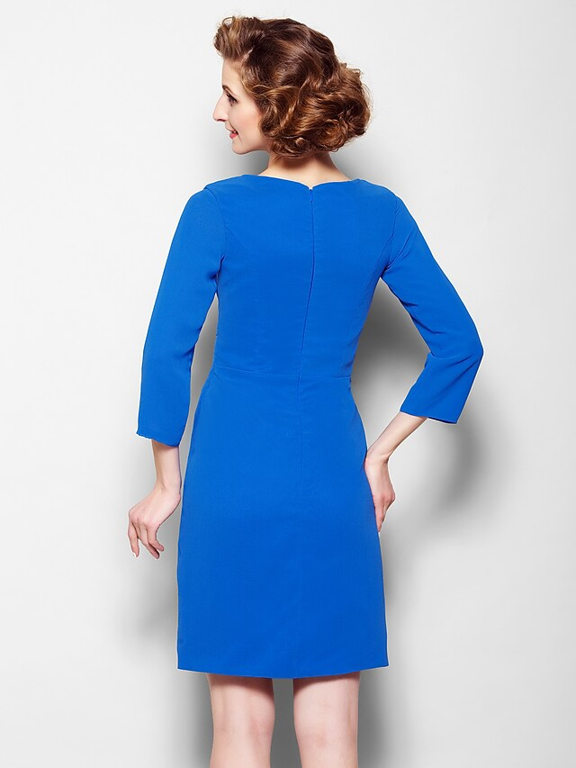 Detail of the scoop neck and 3/4 sleeves on the chiffon dress.