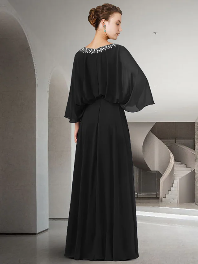 Full view of the elegant chiffon Mother of the Bride dress, showcasing its floor-length design and split front.