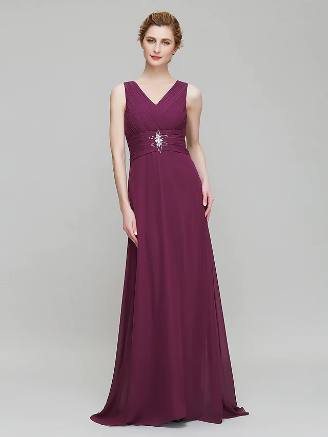 Side profile of formal V-neck dress, showing flowing chiffon fabric.