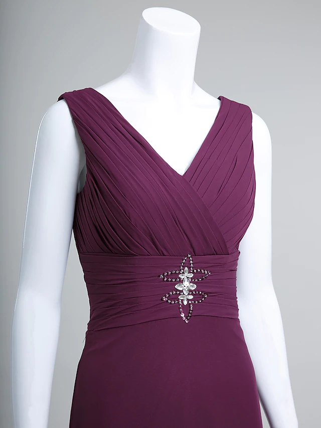 Model wearing a V-neck chiffon dress, suitable for wedding occasions.