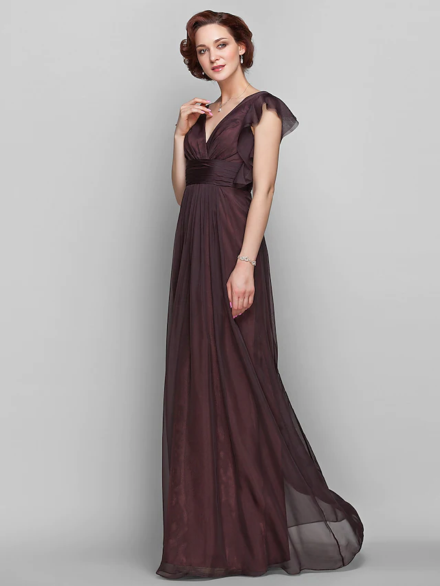 Side profile of the chiffon gown showcasing its draped design.