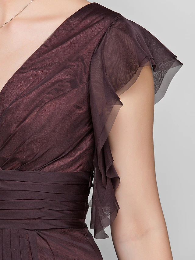 Flowing skirt and train of the elegant chiffon formal dress.