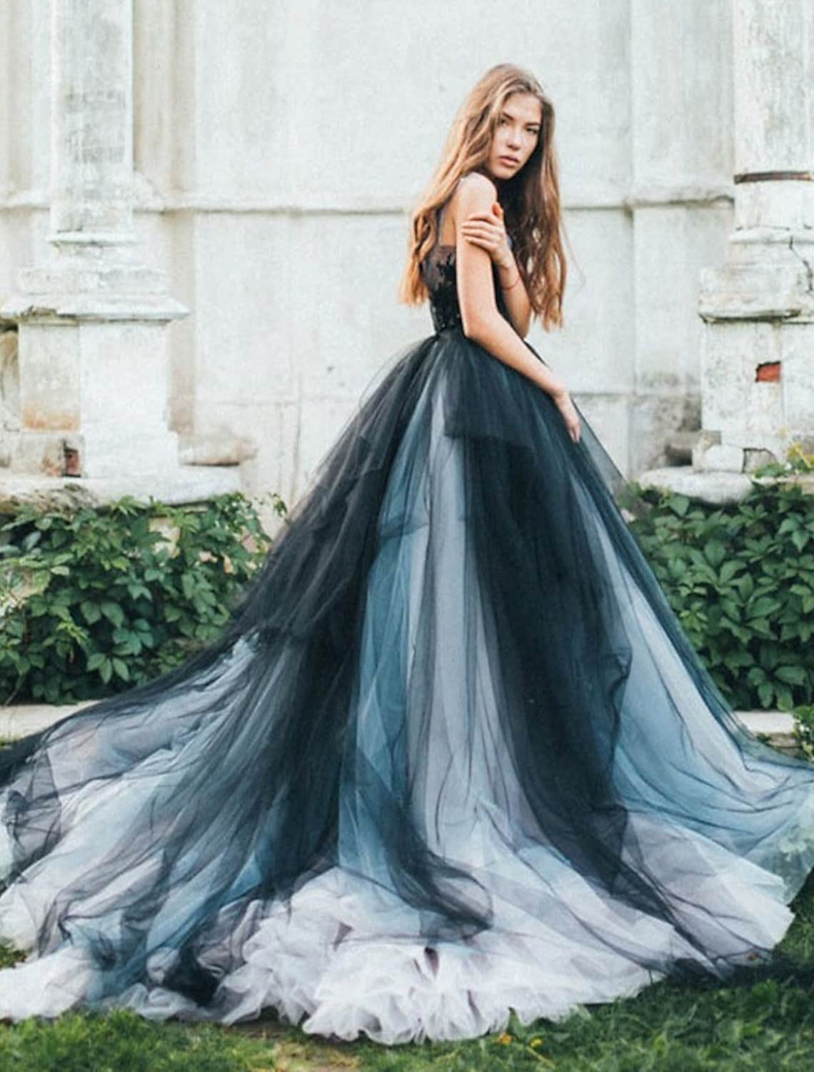 Elegant color block ball gown with V-neck and appliques.