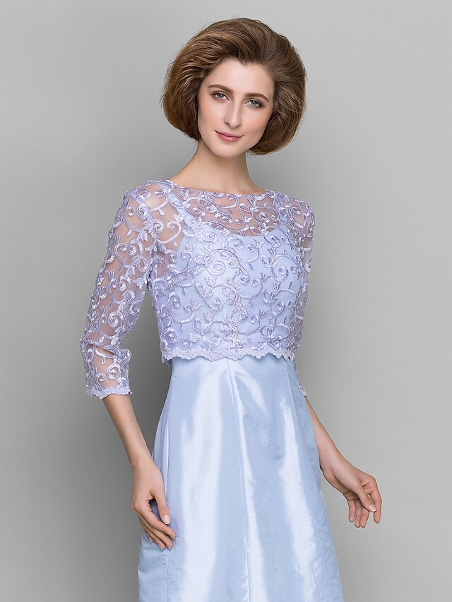 Close-up detail of the delicate lace on the 3/4 sleeves.