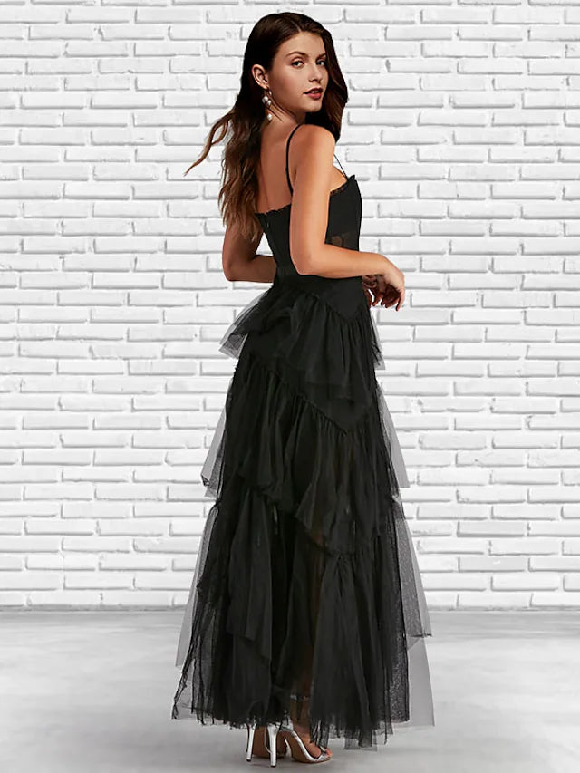 Close-up of the ladder back detail on a ruffled tulle dress.